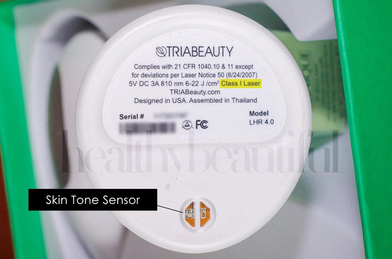 Tria 4x Bottom View, Close Up: Tria 4x's safety mechanisms include a skin tone sensor and a contact sensor. Its diode laser is classified as Class 1 Laser.