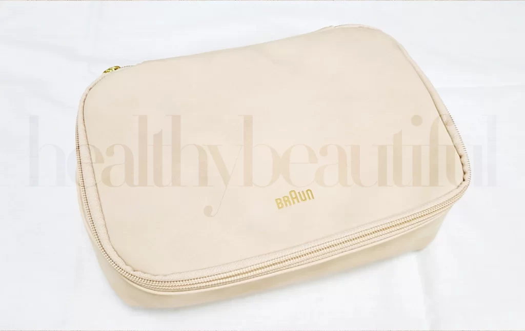 The BRAUN Beauty Pouch comes in either a cream color or a golden printed version.