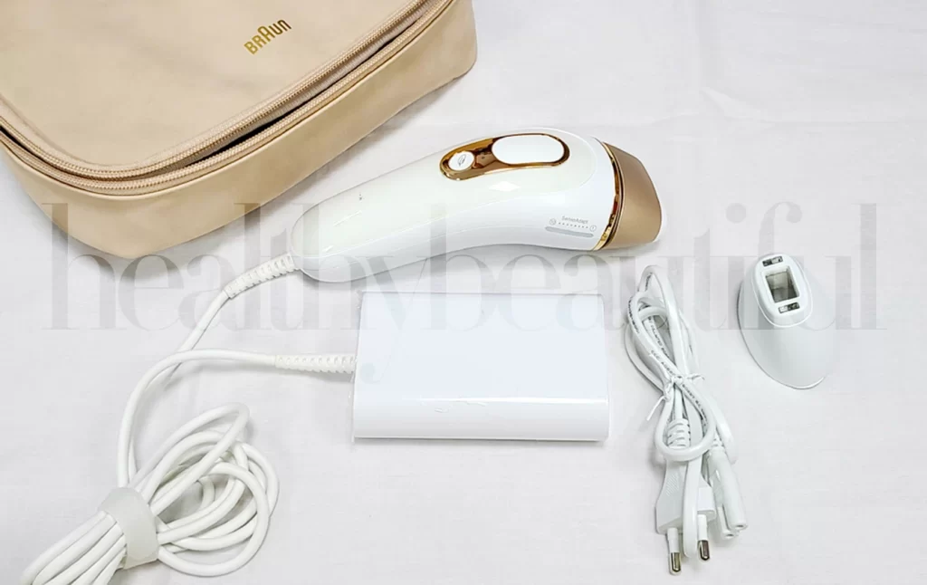 The BRAUN Beauty Pouch, Silk’n-Expert Pro 5 with the standard head (attached), Precision head, base station, and the mains cord.